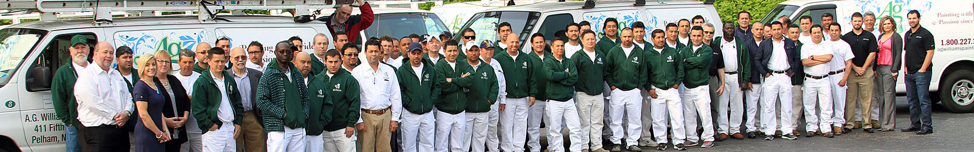 A.G. Williams team photo with company vehicles