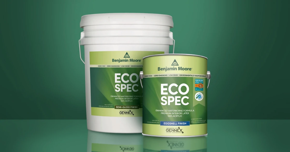 Five-gallon pail of Benjamin Moore Eco Spec semi-gloss and a one-gallon eggshell can, both with zero-VOC and Gennex labeling, against a green background.