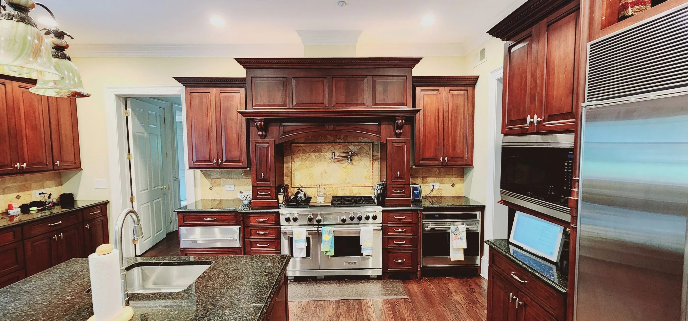 Harrison kitchen before cabinet refinishing.