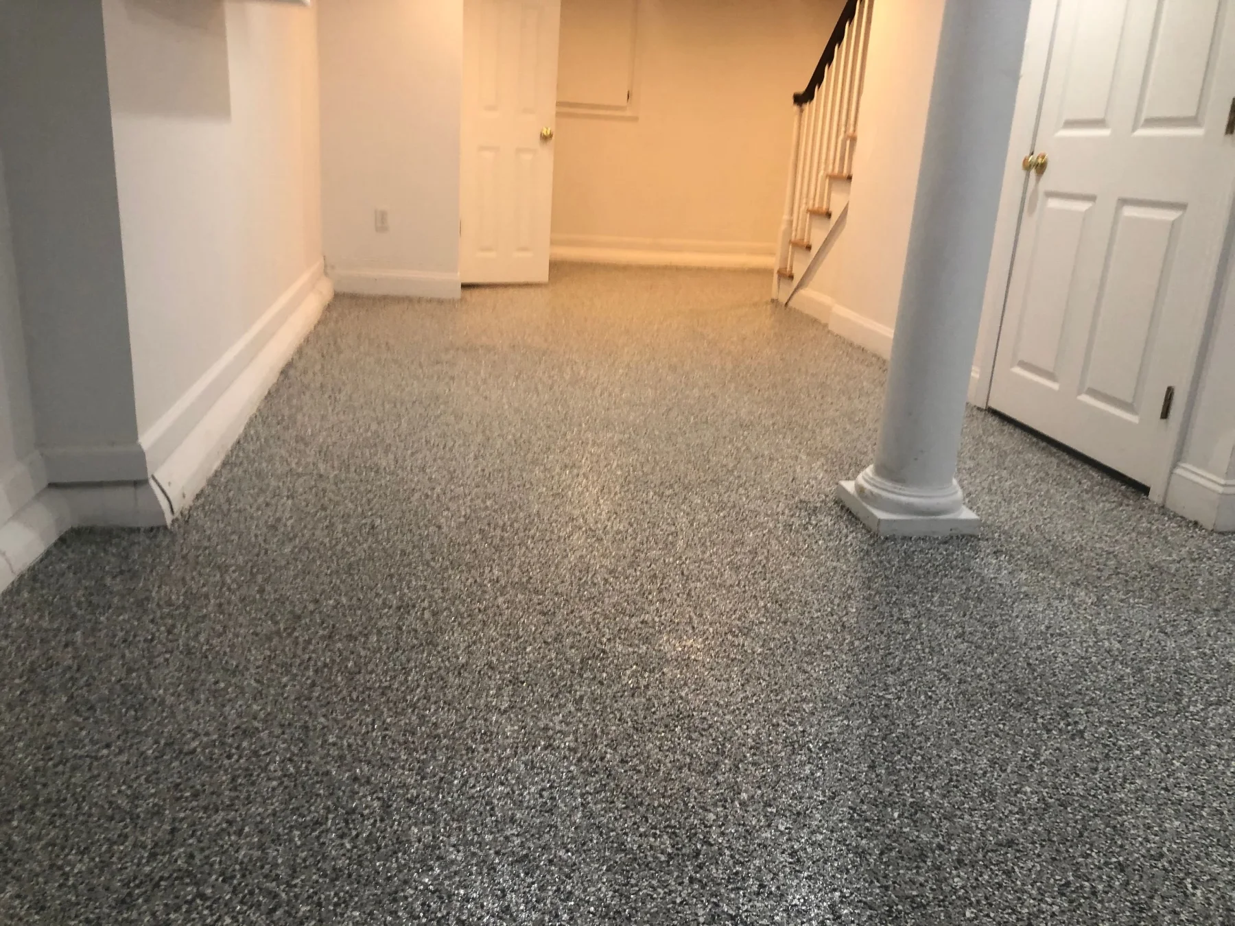 Same basement floor after a gray flake coating